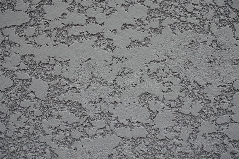 Close Shot of Gray Semi Smooth Wall with Stucco Lace Finish Stock Photo