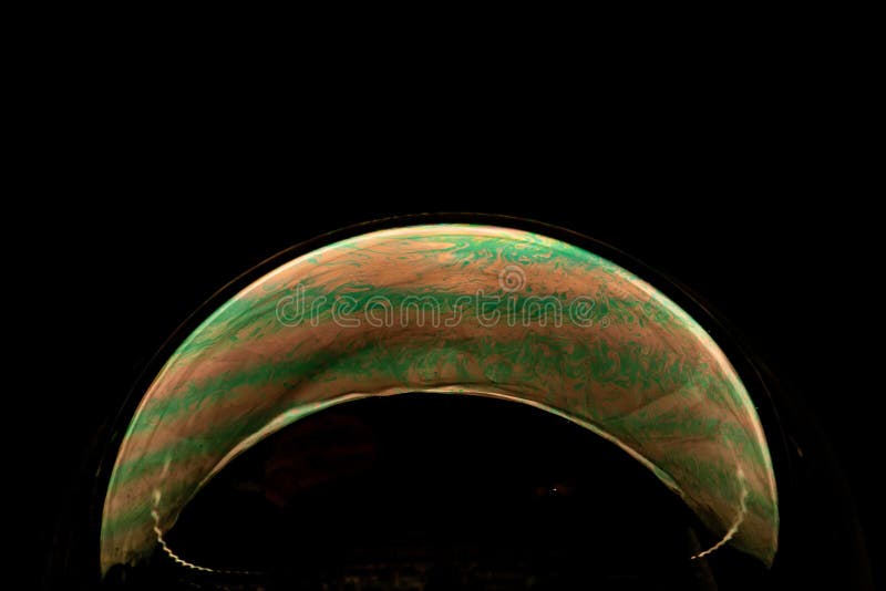 Close up abstract photo yellow soap bubbles on a black background stock photography