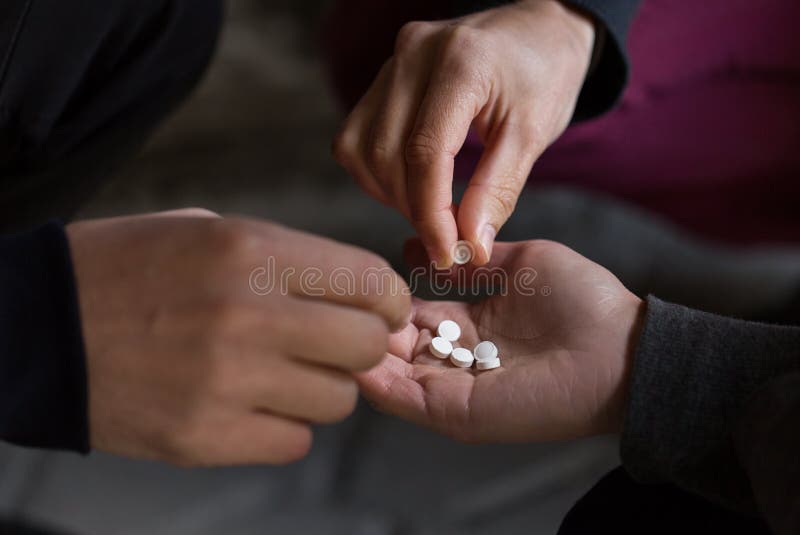 Substance abuse, addiction and people concept - close up of addicts using drugs outdoors. Substance abuse, addiction and people concept - close up of addicts using drugs outdoors