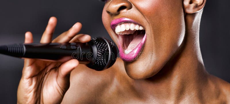 Close-up of African American woman singing. Close-up photo of African American woman singing