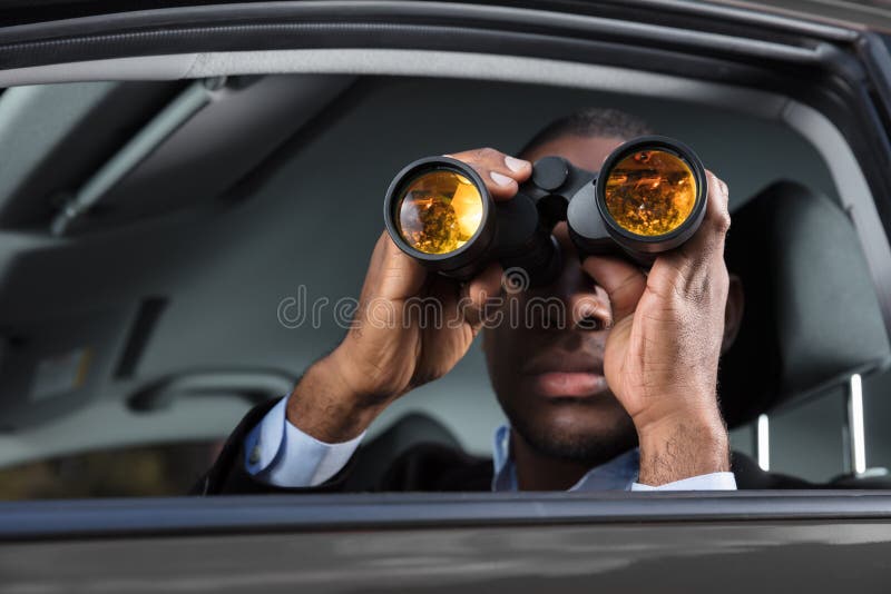 African Man Looking Through Binocular stock photo