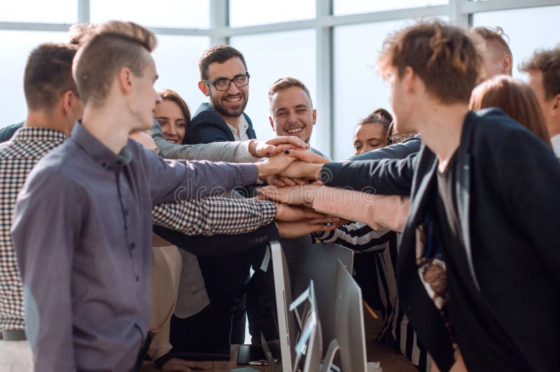 Close Up Group Of Young Business People Putting Their Palms Together