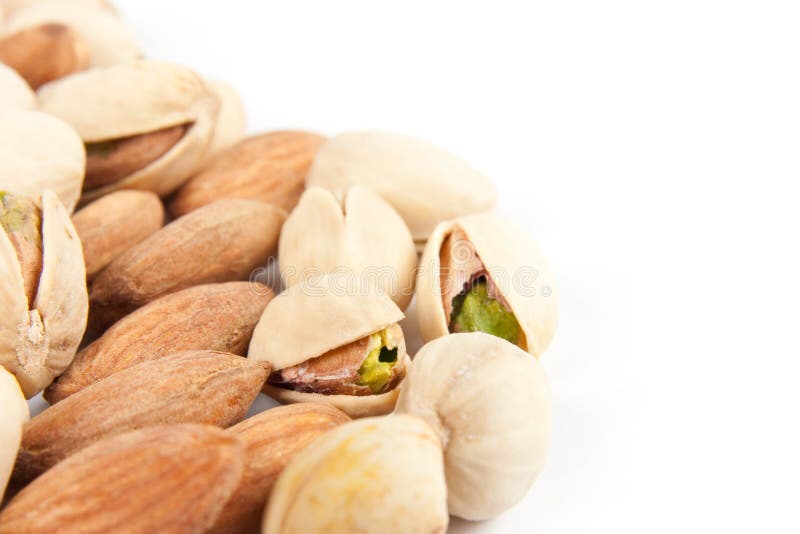 Close-up almonds and pistachios royalty free stock photography