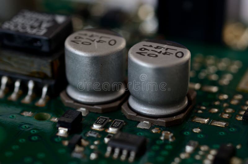 Close up aluminum electrolytic capacitors on PCB royalty free stock photo Close up aluminum electrolytic capacitors on PCB royalty free stock photo
