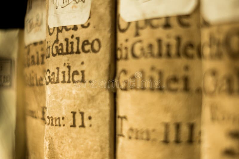 Close up of ancient galileo galilei books on display at bologna university library in italy, symbol of science and knowledge