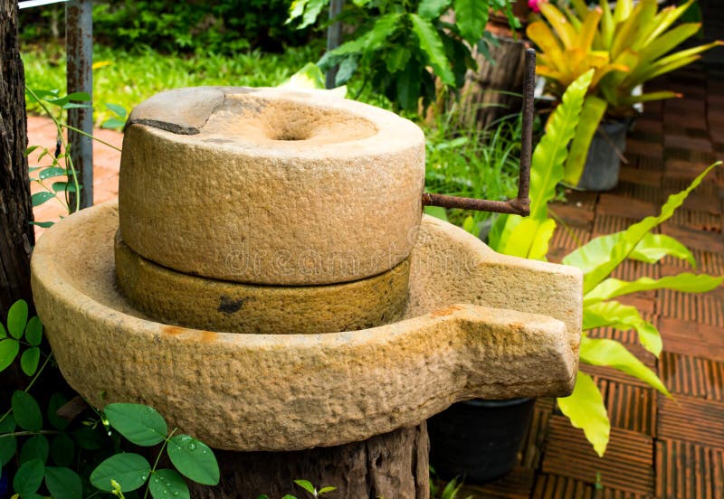 Close up ancient tool, starch crusher old decoration in the local cafe at Lampang, north of Thailand stock images Close up ancient tool, starch crusher old decoration in the local cafe at Lampang, north of Thailand stock images