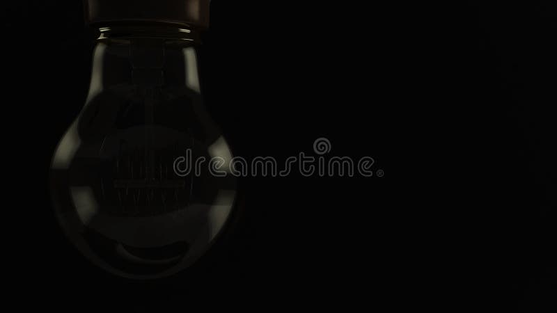 Close up animation of a vintage hanging light bulb turning on over dark background. 4K resolution. 5 seconds. royalty free illustration