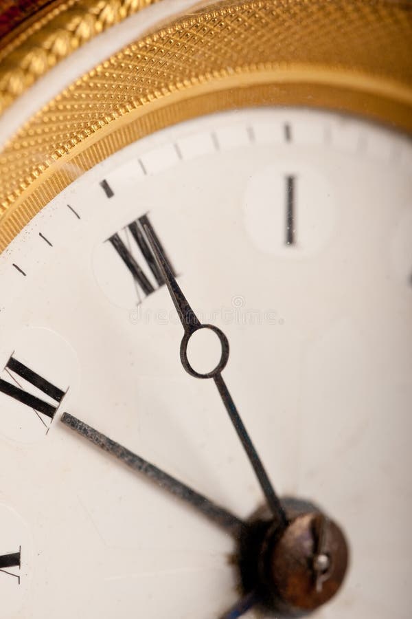 Close-up of antique white and gold clock stock photography