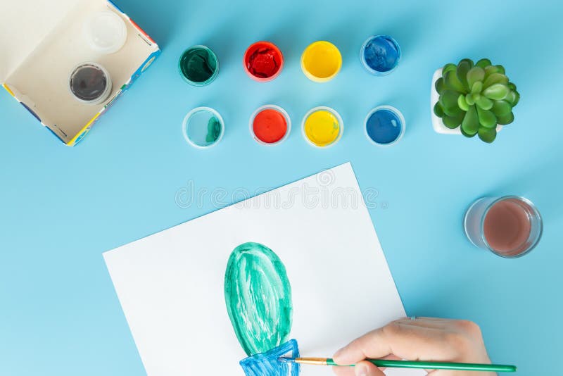 Close up of artist with palette and brush painting cactus on paper at studio vector illustration Close up of artist with palette and brush painting cactus on paper at studio vector illustration