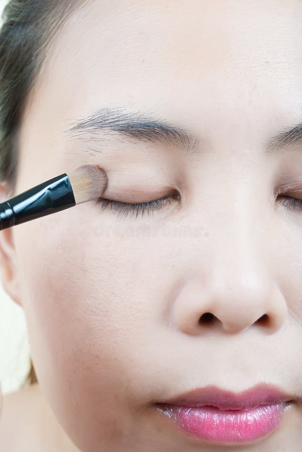 Close up Asian young woman make up. stock images