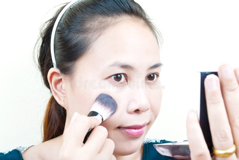 Close up Asian young woman make up. stock images