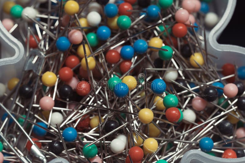 Close up of assortment of colorful sewing pins stock photo