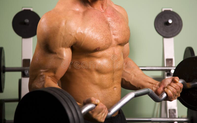 Close-up of an athletic man lifting weights