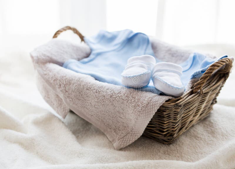 Close up of baby clothes for newborn boy in basket royalty free stock photography Close up of baby clothes for newborn boy in basket royalty free stock photography