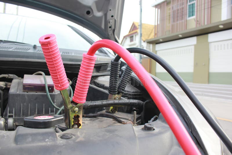 Close-Up of Battery jumper cables to car battery royalty free stock photo Close-Up of Battery jumper cables to car battery royalty free stock photo