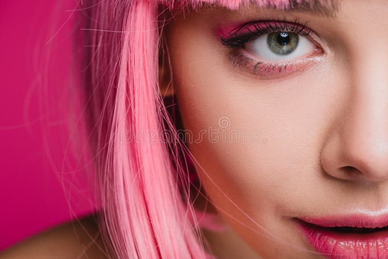 beautiful stylish girl in pink wig holding scissors isolated on pink, Stock image