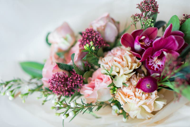 Close-up beautiful luxury bouquet of mixed flowers in glass vases. Bouquet of roses, carnations and orchids. royalty free stock image Close-up beautiful luxury bouquet of mixed flowers in glass vases. Bouquet of roses, carnations and orchids. royalty free stock image