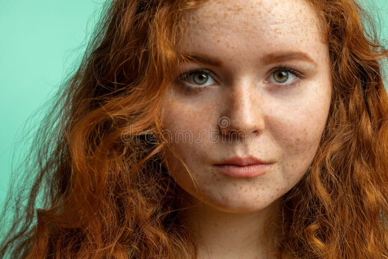 Close Up Of Beautiful Red Haired Freckled Girl With Loose Curly Hair 