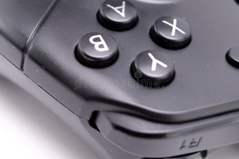 Close-up of a Black Game Controller with A, B, X, Y Buttons on White Background royalty free stock photography