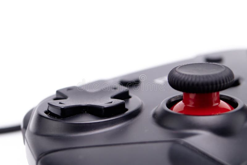 Close-up of a Black Game Controller with Red Joystick on White Background stock photography