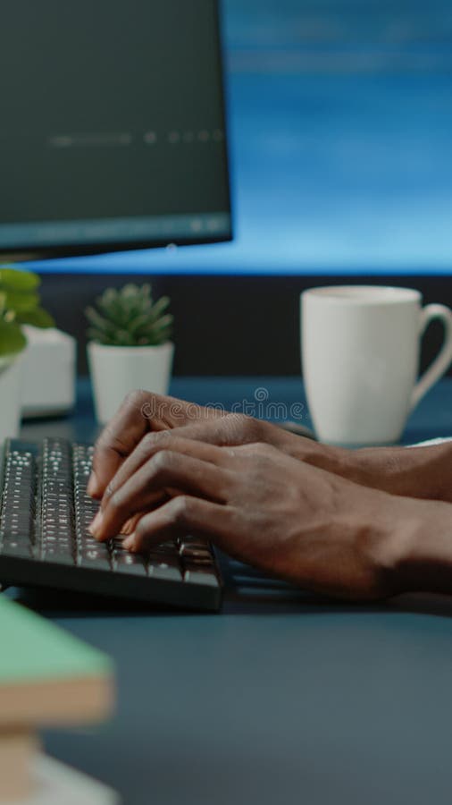 Close up of black hands coding server interface with binary codes stock photography