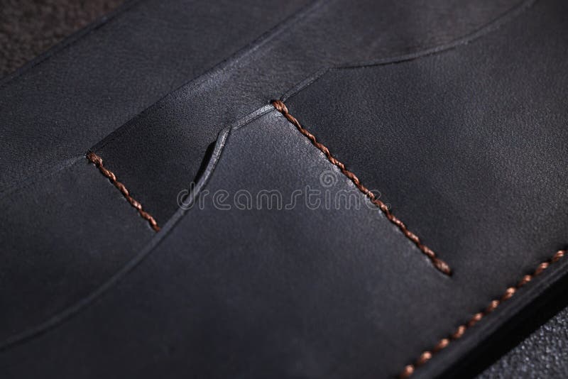 Black leather wallet showing stitching detail and pocket compartments royalty free stock image