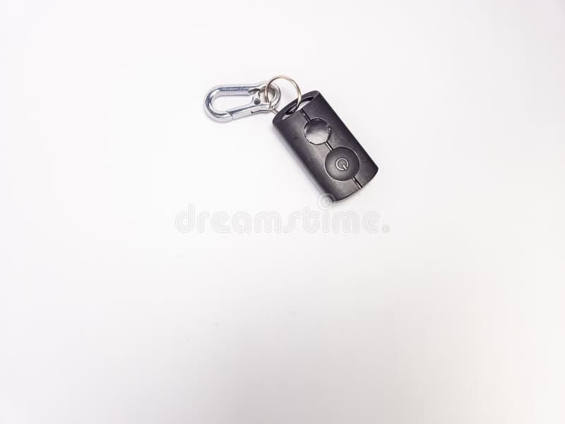 Close-up of a black remote control with a carabiner on a white background royalty free stock photography