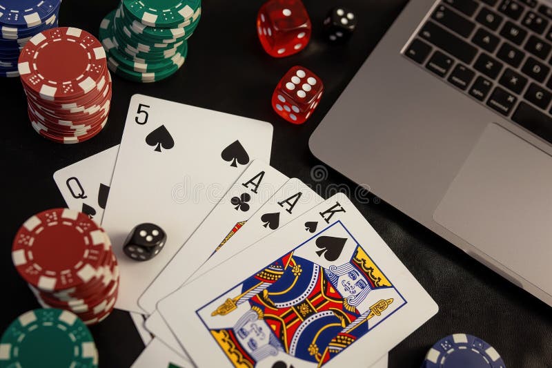 Close-up of a black table with playing cards, chips, and a laptop. Online poker game setup with computer, dice, and cards. Top royalty free illustration