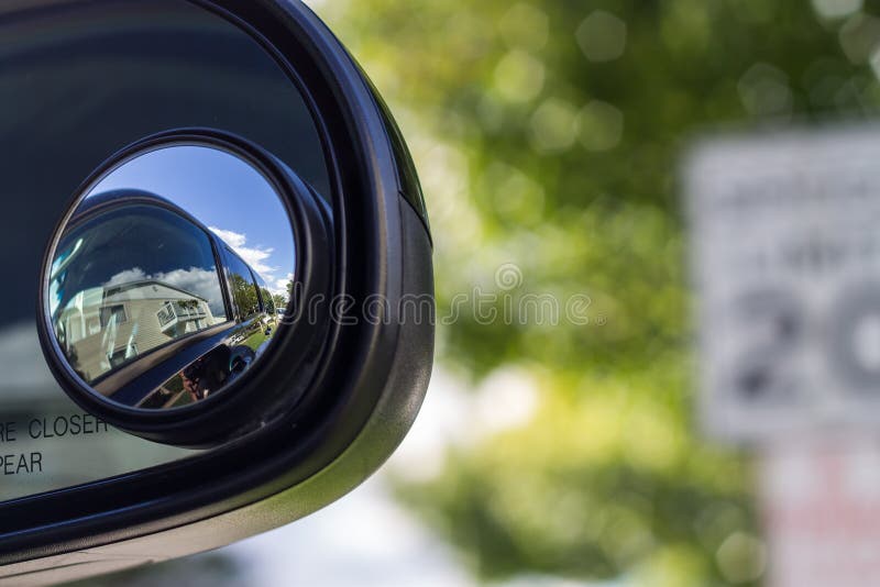 Close up of a blind spot mirror on the passenger side royalty free stock images