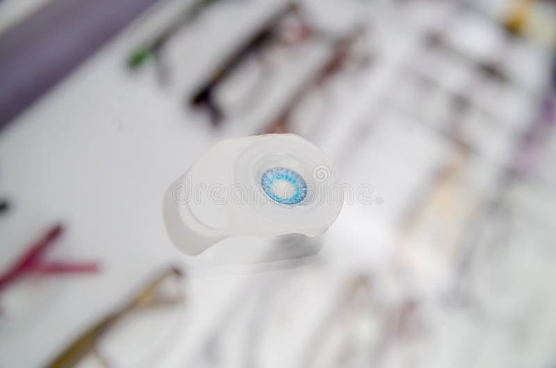 Close Up of a Blue Contact Lenses, Inside the Optical Over a Showcase
