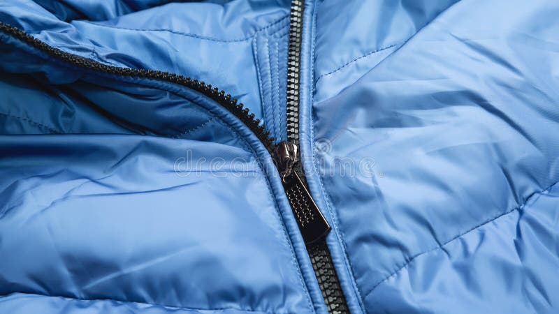 Close-up on Blue Puffer Jacket Texture with Zipper. Fabric Background ...