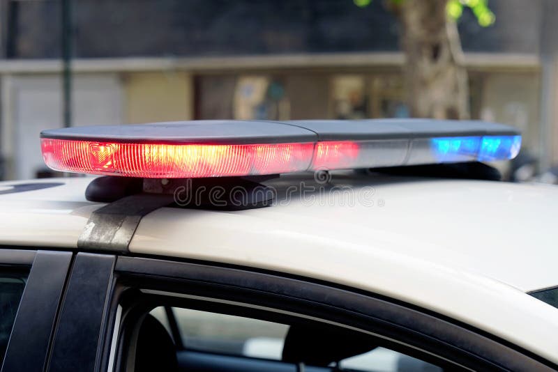 Blue and red lights on top of police car