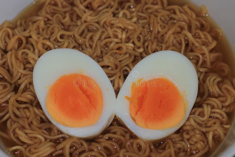 Closeup of Boiled Egg on Noodle. Stock Photo Image of close, food
