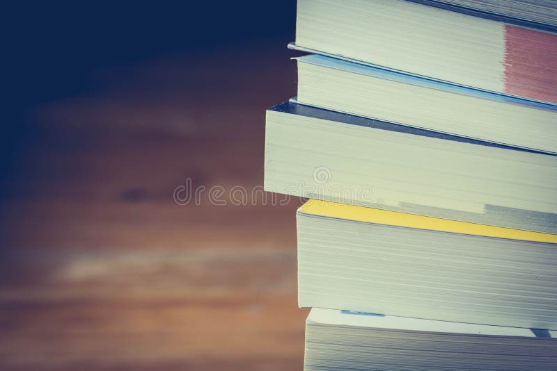 Close up book stack on wood table,selective focus