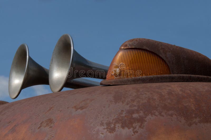 Close-up of the boundary light and chrome horn of an old rusty scraper wagon stock photo
