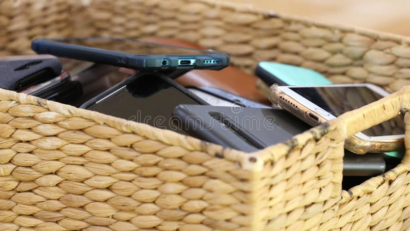 Close up of a box or basket of collected mobile cell phones collected