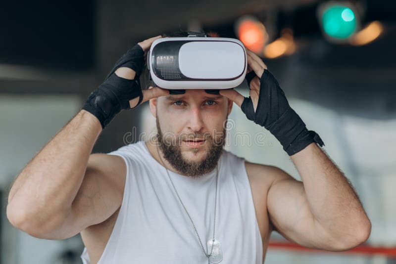 Attractive Man Boxing In VR 360 Headset Training For Kicking In Virtual