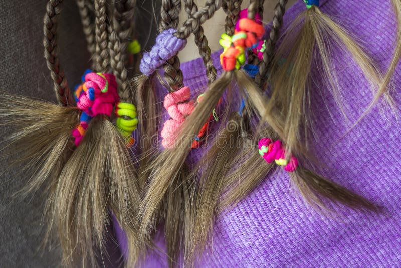 Close Up of Braid Hair of Little Girl with Colorful Rubber Bands