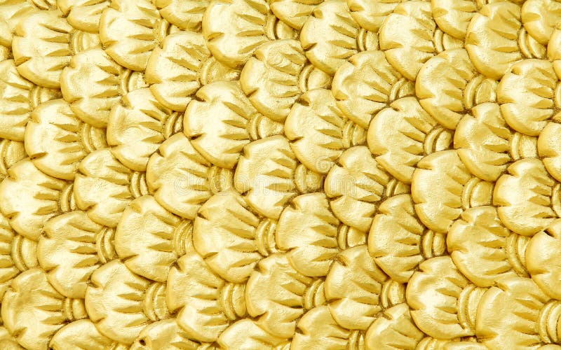 Bright gold serpent scale statue patterns or colorful yellow naga texture abstract for background royalty free stock photos