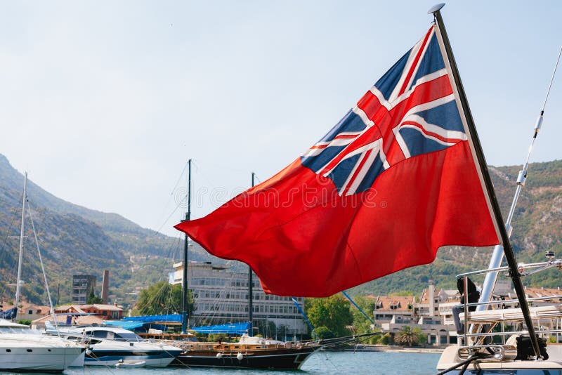 Close-up of the British Red Ensign Aboard a Ship with Ships and ...