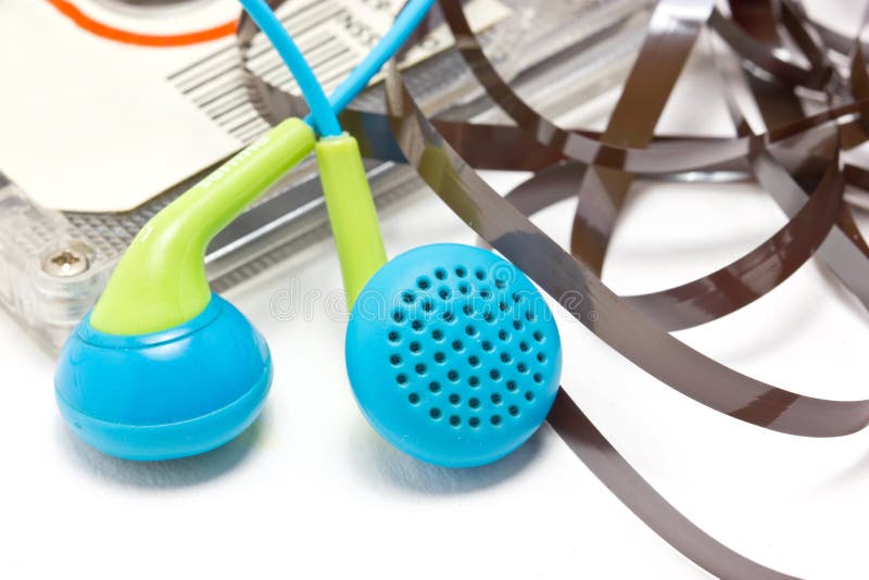 Close Up Of Broken Audio Cassette. With Earphones. stock images