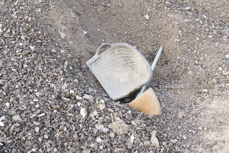 Bucket and stones in construction side stock photo