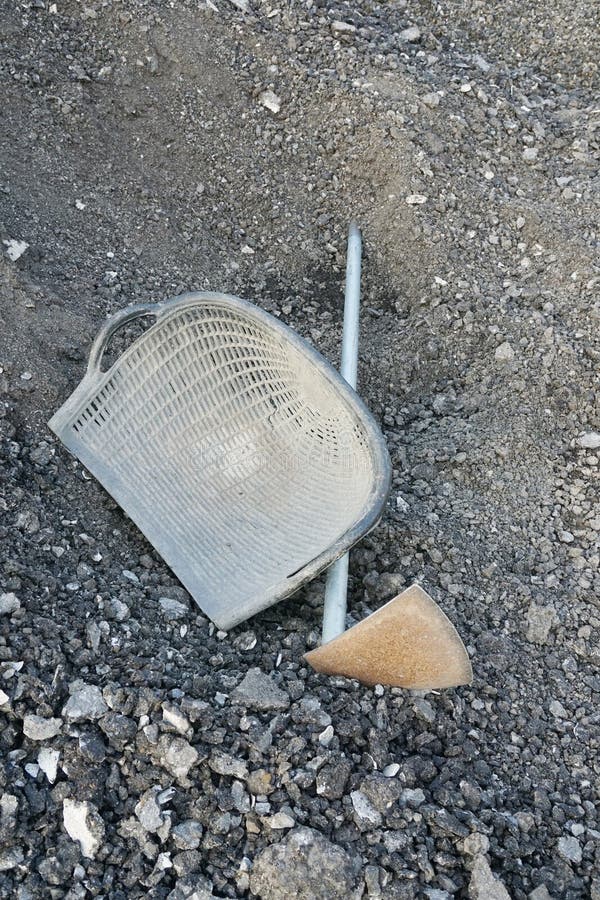 Bucket and stones in construction side stock photography