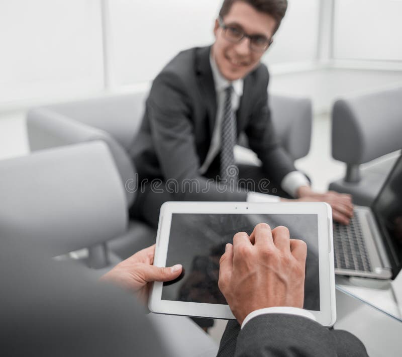 Close up.businessman with a digital tablet in a modern office stock photos Close up.businessman with a digital tablet in a modern office stock photos