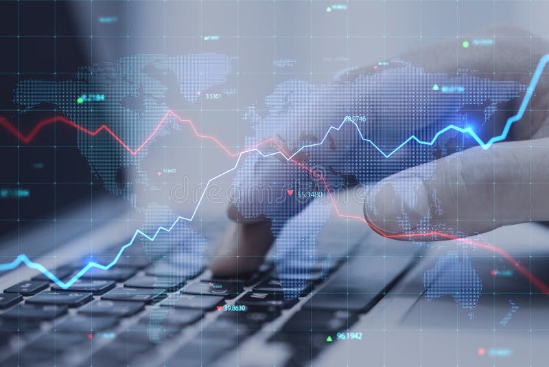 Close up of businessman hands using laptop keyboard with creative glowing blue map hologram with chart and grid on blurry stock image