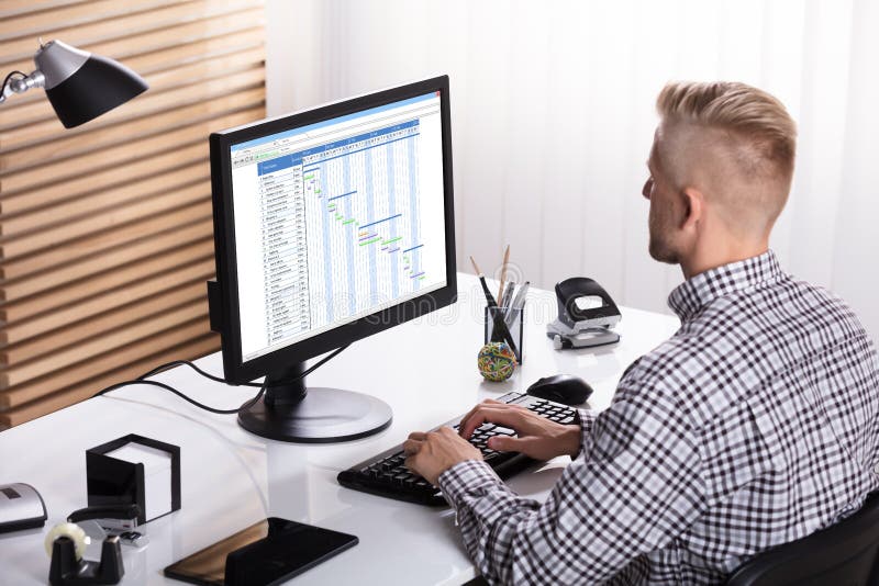 Businessman Working On Gantt Chart royalty free stock image Businessman Working On Gantt Chart royalty free stock image