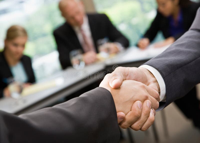 Close up of businessmen shaking hands