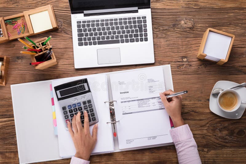 Businesswoman Calculating Invoice royalty free stock image Businesswoman Calculating Invoice royalty free stock image