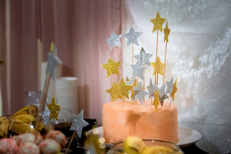 Close up of a candy bar peach color cake. The concept of the holiday, wedding, baby shower, birthday.