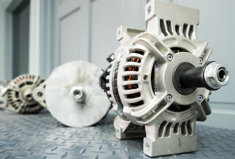 Close up of car alternator on display on metal shelf/auto parts.